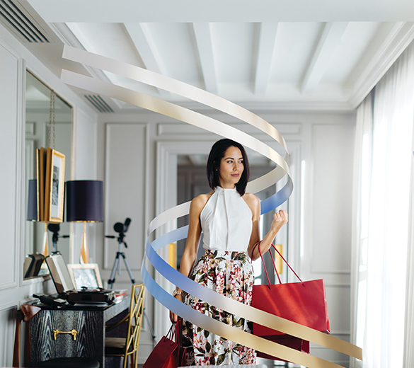 Image of woman walking with shopping bags
